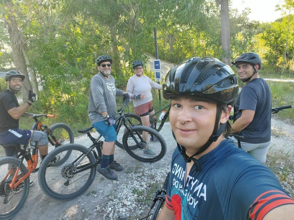 Five people take a selfie with their mountain bikes on the Quiet Waters Trail in Broward County Five people take a selfie with their mountain bikes on the Quiet Waters Trail in Broward County